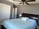 Serene main bedroom featuring a comfortable bed, neutral walls, and ample closet space for storage at 7800 125Th St, Seminole, FL 33772
