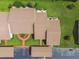Overhead view showcases the roof of a condo and its manicured green lawn at 7923 Radcliffe Cir, Port Richey, FL 34668
