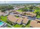 Scenic aerial view of a residential community with well-maintained landscaping and a pond at 7923 Radcliffe Cir, Port Richey, FL 34668