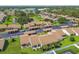 Scenic aerial view of a residential community with well-maintained landscaping and a pond at 7923 Radcliffe Cir, Port Richey, FL 34668