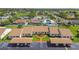 Property aerial view showcasing the community, nearby homes, and well-manicured green spaces at 7923 Radcliffe Cir, Port Richey, FL 34668