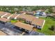 Community aerial view showcasing well-maintained landscaping, covered parking, and guest parking spots at 7923 Radcliffe Cir, Port Richey, FL 34668