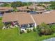 Aerial view of a condo with a cozy patio and well-manicured backyard at 7923 Radcliffe Cir, Port Richey, FL 34668