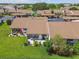 Aerial view of a condo with a cozy patio and well-manicured backyard at 7923 Radcliffe Cir, Port Richey, FL 34668