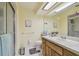 Bathroom with a glass enclosed shower, neutral walls, and tile floor at 7923 Radcliffe Cir, Port Richey, FL 34668