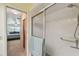 Glass enclosed shower with shower head and handle at 7923 Radcliffe Cir, Port Richey, FL 34668