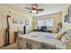 Bedroom with a desk, computer, ceiling fan, and giraffe statue at 7923 Radcliffe Cir, Port Richey, FL 34668
