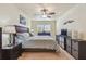 Bedroom with neutral palette, ceiling fan, and complementary furnishings at 7923 Radcliffe Cir, Port Richey, FL 34668