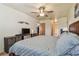 Bedroom with a TV and view into the bathroom at 7923 Radcliffe Cir, Port Richey, FL 34668