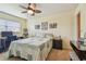 Bedroom featuring neutral walls, ceiling fan, desk and computer at 7923 Radcliffe Cir, Port Richey, FL 34668