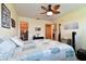 Bedroom featuring ample closet space, decorative touches, and a unique ceiling fan at 7923 Radcliffe Cir, Port Richey, FL 34668