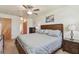Bedroom featuring a wooden bed frame and neutral decor at 7923 Radcliffe Cir, Port Richey, FL 34668