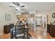 Dining room with wood table and view into the kitchen and entryway at 7923 Radcliffe Cir, Port Richey, FL 34668