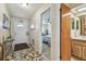 Inviting entryway featuring tile flooring, with a bathroom and a bedroom doorway visible at 7923 Radcliffe Cir, Port Richey, FL 34668