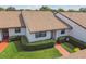 Charming condo with a well-kept lawn and manicured bushes in front at 7923 Radcliffe Cir, Port Richey, FL 34668