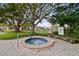 Enjoy the luxurious community hot tub surrounded by lush green landscaping at 7923 Radcliffe Cir, Port Richey, FL 34668