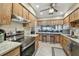 Modern kitchen overlooking open floorplan living area with breakfast bar at 7923 Radcliffe Cir, Port Richey, FL 34668