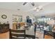 Bright, open living space featuring a spacious dining room, comfortable seating, and plenty of natural light from sliding glass doors at 7923 Radcliffe Cir, Port Richey, FL 34668
