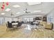 Large resident meeting room featuring tables, chairs, and a tv at 7923 Radcliffe Cir, Port Richey, FL 34668