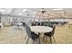 Spacious meeting room with tables, chairs, and comfortable seating area at 7923 Radcliffe Cir, Port Richey, FL 34668
