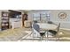 Resident lounge area with a large table, seating, and a television at 7923 Radcliffe Cir, Port Richey, FL 34668