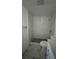 Bathroom featuring a walk-in shower, hexagon mosaic flooring and neutral tile at 8602 Huron Court # 47, Tampa, FL 33614