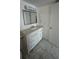 Bright bathroom with updated vanity, granite countertop, and large framed mirror at 8602 Huron Court # 47, Tampa, FL 33614