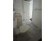 Bathroom featuring marble tile floor, updated sink and medicine cabinet with a toilet at 8602 Huron Court # 47, Tampa, FL 33614