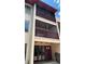 Condominium building featuring screened patios and classic exterior architectural elements at 8602 Huron Court # 47, Tampa, FL 33614