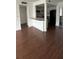 Inviting living area with hardwood floors and pass-through to kitchen at 8602 Huron Court # 47, Tampa, FL 33614