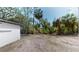Back exterior of the house with trees at 9218 Memorial Hwy, Tampa, FL 33615