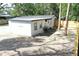 Back exterior of the house with a newly fenced backyard at 9218 Memorial Hwy, Tampa, FL 33615