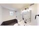 Stylish bathroom featuring sleek fixtures, a framed mirror, and black and white tile accents at 9218 Memorial Hwy, Tampa, FL 33615