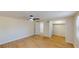 Spacious bedroom with ceiling fan, closet, and wood-look flooring at 9218 Memorial Hwy, Tampa, FL 33615