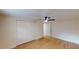 Bright bedroom with ceiling fan, closet, and wood-look floors at 9218 Memorial Hwy, Tampa, FL 33615