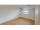 Bedroom with ceiling fan and wood-look flooring at 9218 Memorial Hwy, Tampa, FL 33615