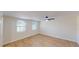 Bright bedroom with light wood floors and a ceiling fan offers a serene retreat at 9218 Memorial Hwy, Tampa, FL 33615