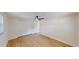 Spacious bedroom with wood floors, a ceiling fan, and ample closet space for storage at 9218 Memorial Hwy, Tampa, FL 33615