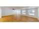 Bright living room with wood-look floors and large windows at 9218 Memorial Hwy, Tampa, FL 33615