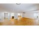 Open-concept living room boasting light wood floors and seamless transitions to other living areas at 9218 Memorial Hwy, Tampa, FL 33615