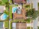 Aerial view showcasing a home with a pool, patio, backyard, and surrounding neighborhood at 9309 120Th St, Seminole, FL 33772