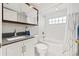 Bathroom with subway tile, shower-tub combo, white vanity and updated fixtures at 9309 120Th St, Seminole, FL 33772