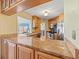 A kitchen featuring granite counters, stainless steel appliances, and wood cabinets at 9309 120Th St, Seminole, FL 33772
