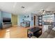 Spacious living room with hardwood floors, barn doors and a modern ceiling fan at 9309 120Th St, Seminole, FL 33772