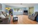 Bright living room with sleek floors, neutral tones, and ample natural light from large windows at 9309 120Th St, Seminole, FL 33772