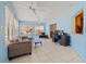 Bright sun room with tile floors, lots of natural light, a desk, and workout equipment at 9309 120Th St, Seminole, FL 33772
