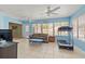 Bright sun room featuring tile floors, lots of natural light, and a comfortable seating area at 9309 120Th St, Seminole, FL 33772