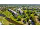 Panoramic aerial view showcasing condo buildings, ponds, and lush landscaping throughout the community at 9461 Harbor Greens Way # 502, Seminole, FL 33776