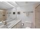 Bathroom with spacious vanity, shower, and light tile at 9461 Harbor Greens Way # 502, Seminole, FL 33776