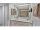 Bathroom with spacious vanity, shower, and light tile at 9461 Harbor Greens Way # 502, Seminole, FL 33776